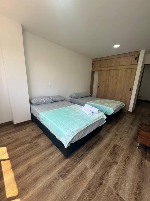 Postel nebo postele na pokoji v ubytování Apartamento en Sonsón