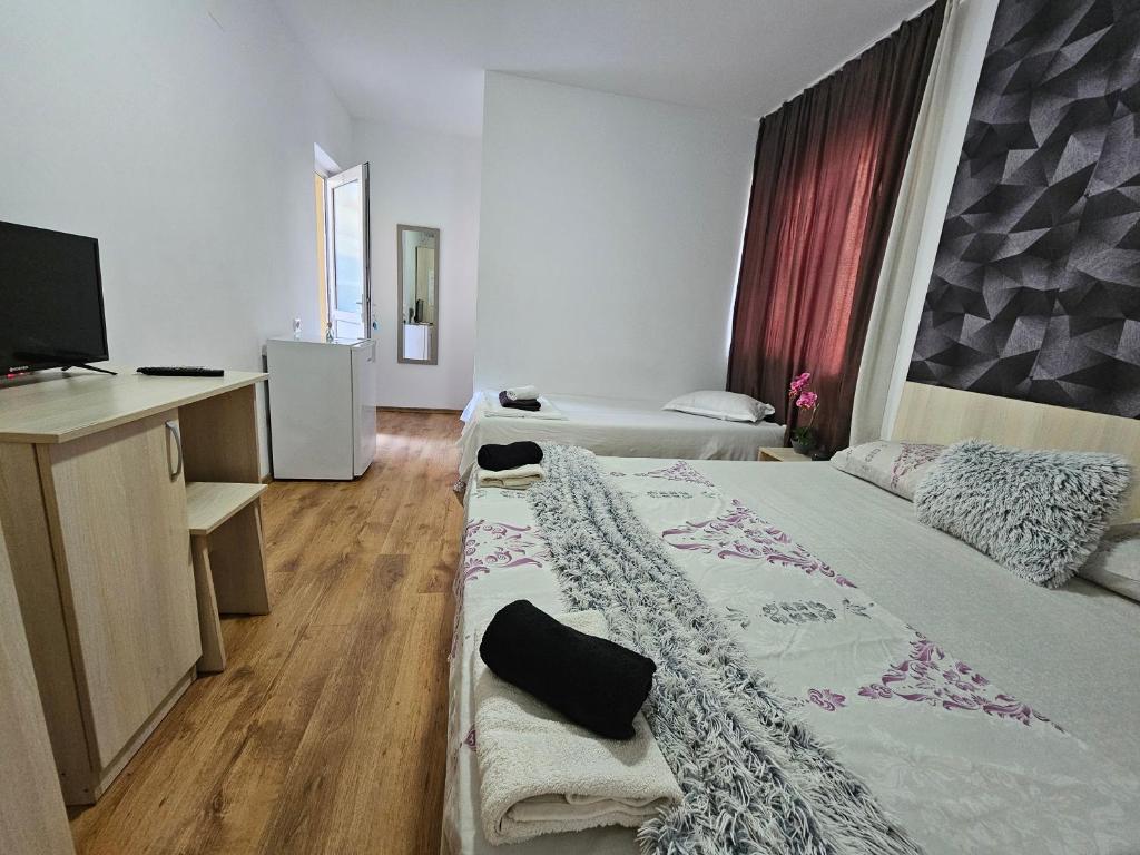 Postel nebo postele na pokoji v ubytování PENSIUNEA SCOICA