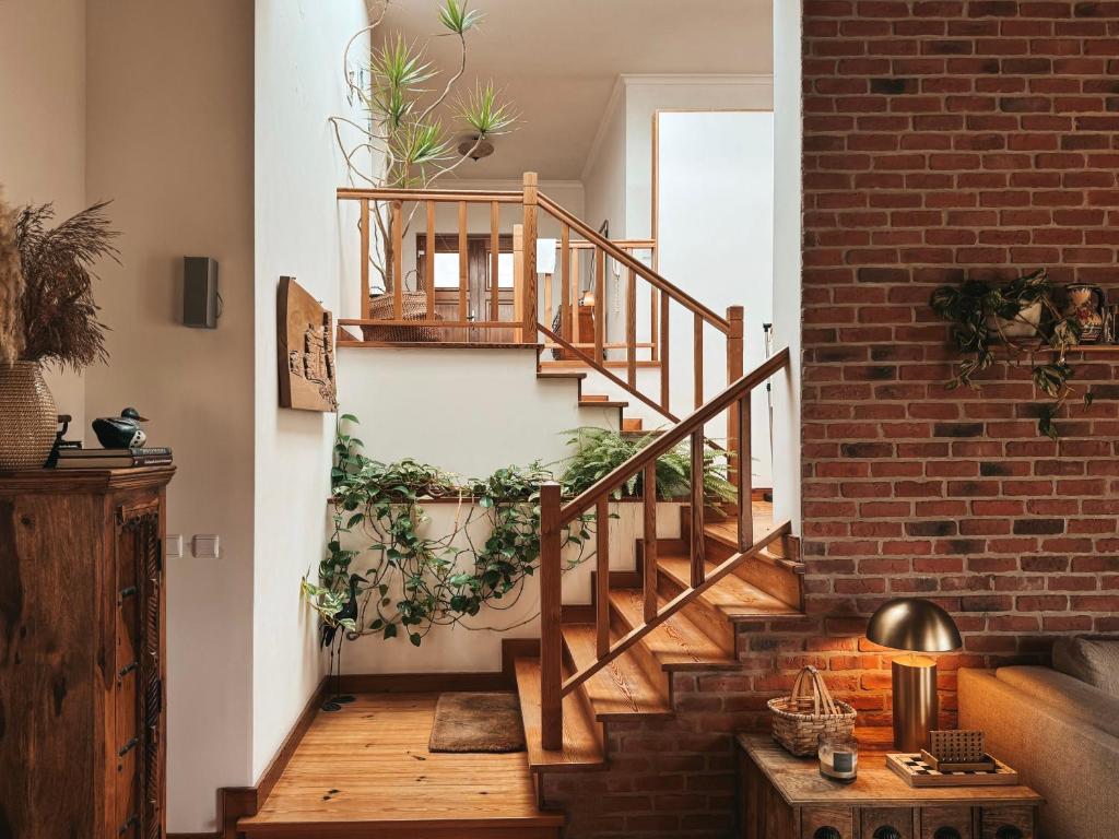 a brick staircase with plants on the wall at Quinta Amarela - B&B in Nazaré
