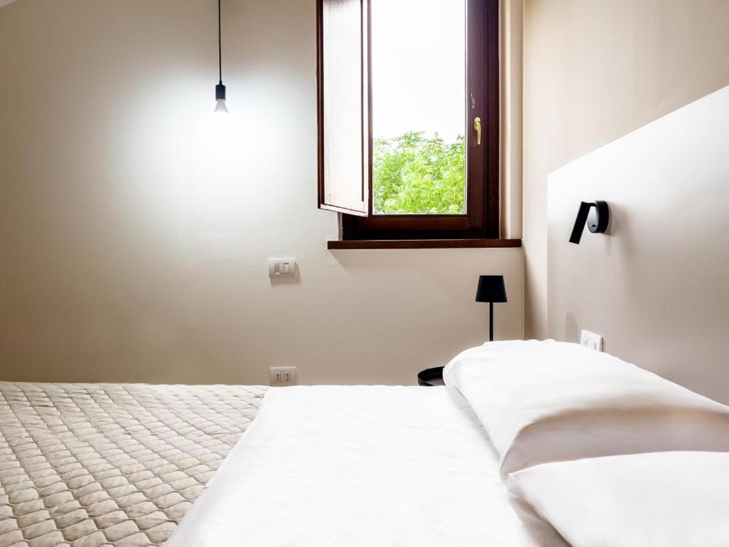 Postel nebo postele na pokoji v ubytování Assisium Agriturismo