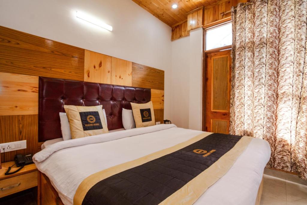 Postel nebo postele na pokoji v ubytování Hotel Cherry Manali