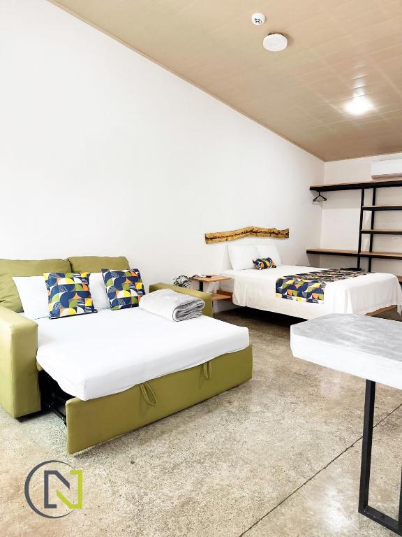 Postel nebo postele na pokoji v ubytování Nomad Living CR Tárcoles