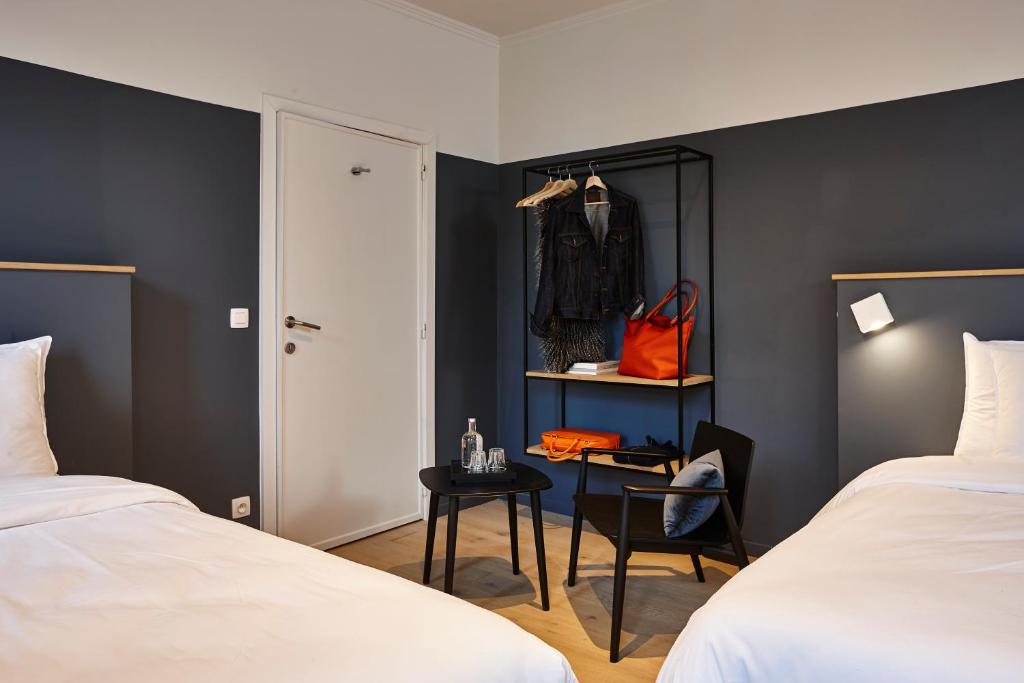 Postel nebo postele na pokoji v ubytování Hotel Monsieur Ernest