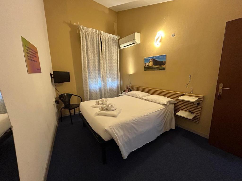 Postel nebo postele na pokoji v ubytování Smart Hotel Autodromo
