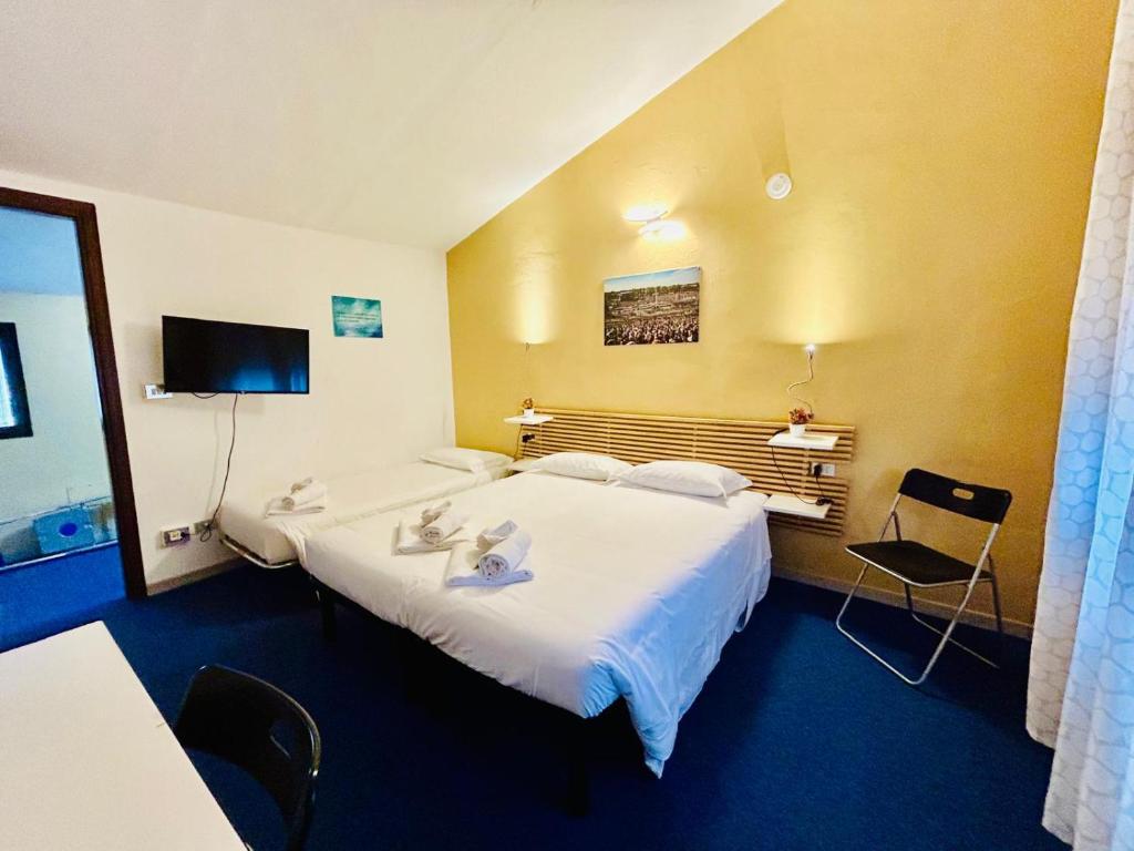 Postel nebo postele na pokoji v ubytování Smart Hotel Autodromo