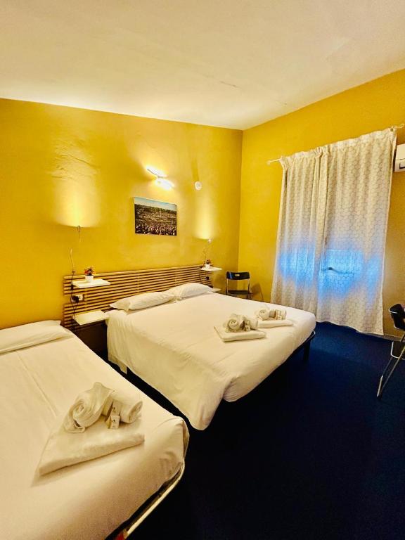 Postel nebo postele na pokoji v ubytování Smart Hotel Autodromo