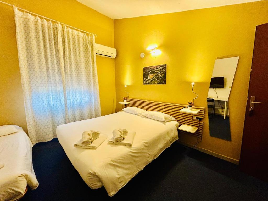 Postel nebo postele na pokoji v ubytování Smart Hotel Autodromo