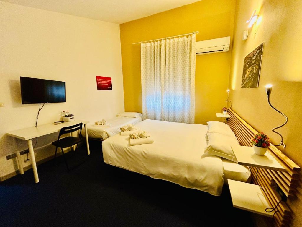 Postel nebo postele na pokoji v ubytování Smart Hotel Autodromo