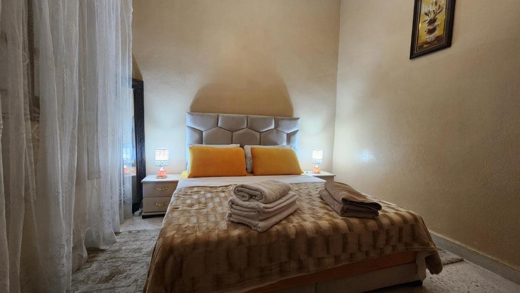 Postel nebo postele na pokoji v ubytování Appartement Riad 5min à pied de l'aéroport