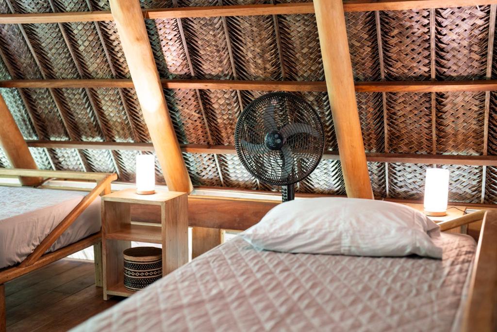 Postel nebo postele na pokoji v ubytování Canto Tayrona Ecolodges