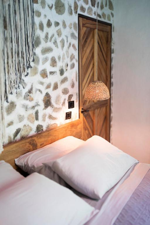 Postel nebo postele na pokoji v ubytování Canto Tayrona Ecolodges