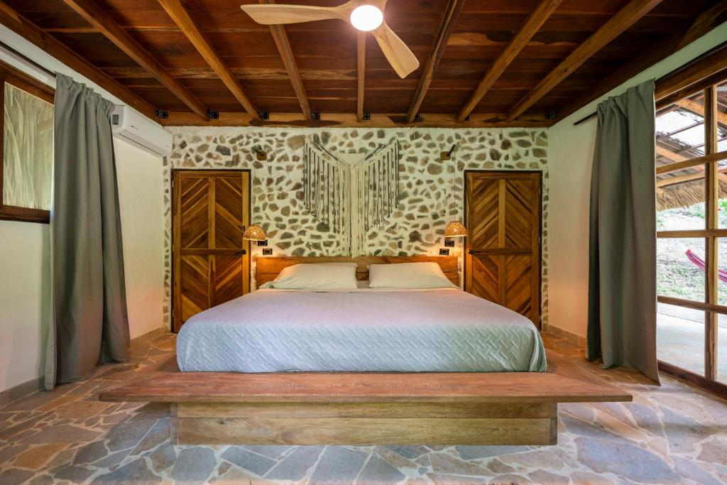 Postel nebo postele na pokoji v ubytování Canto Tayrona Ecolodges