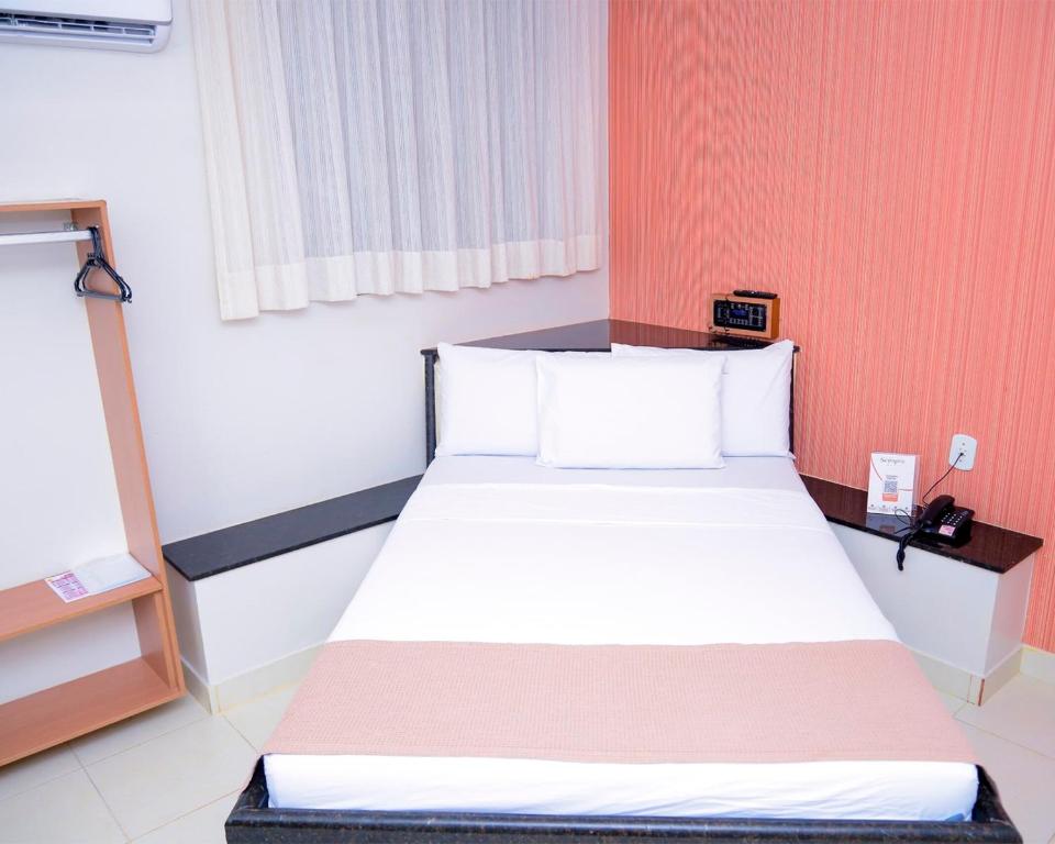 Postel nebo postele na pokoji v ubytování Hotel Sempre Bahia