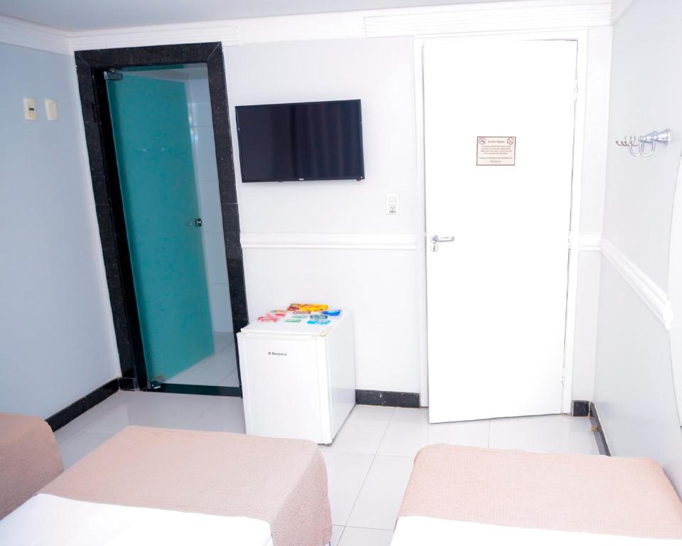 Postel nebo postele na pokoji v ubytování Hotel Sempre Bahia