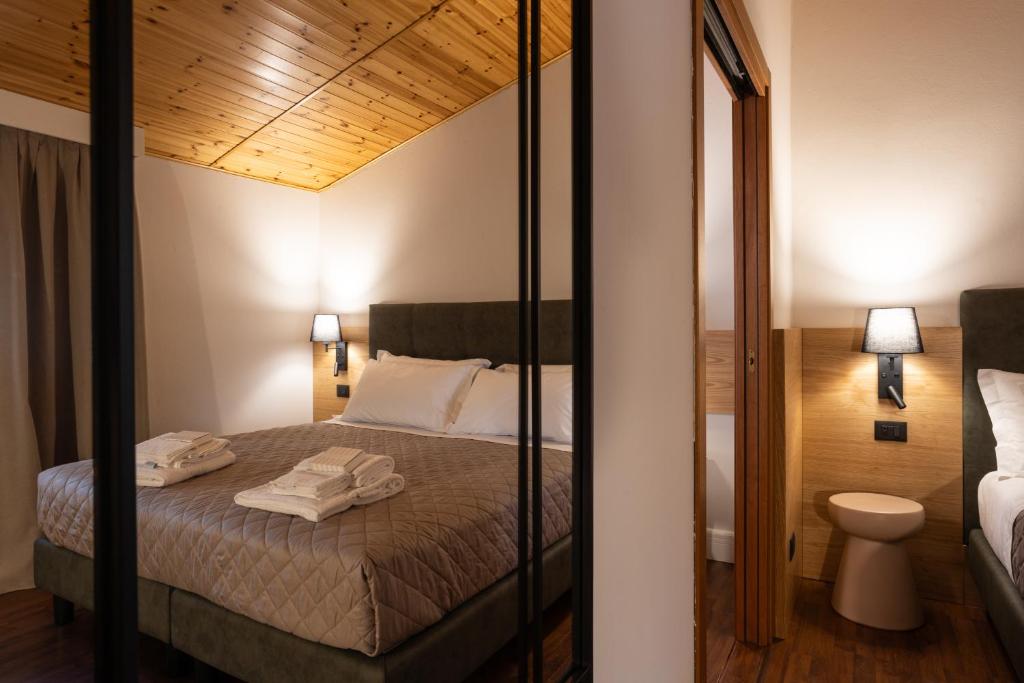 Postel nebo postele na pokoji v ubytování VillaChiara Gradara