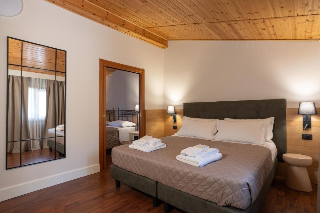 Postel nebo postele na pokoji v ubytování VillaChiara Gradara