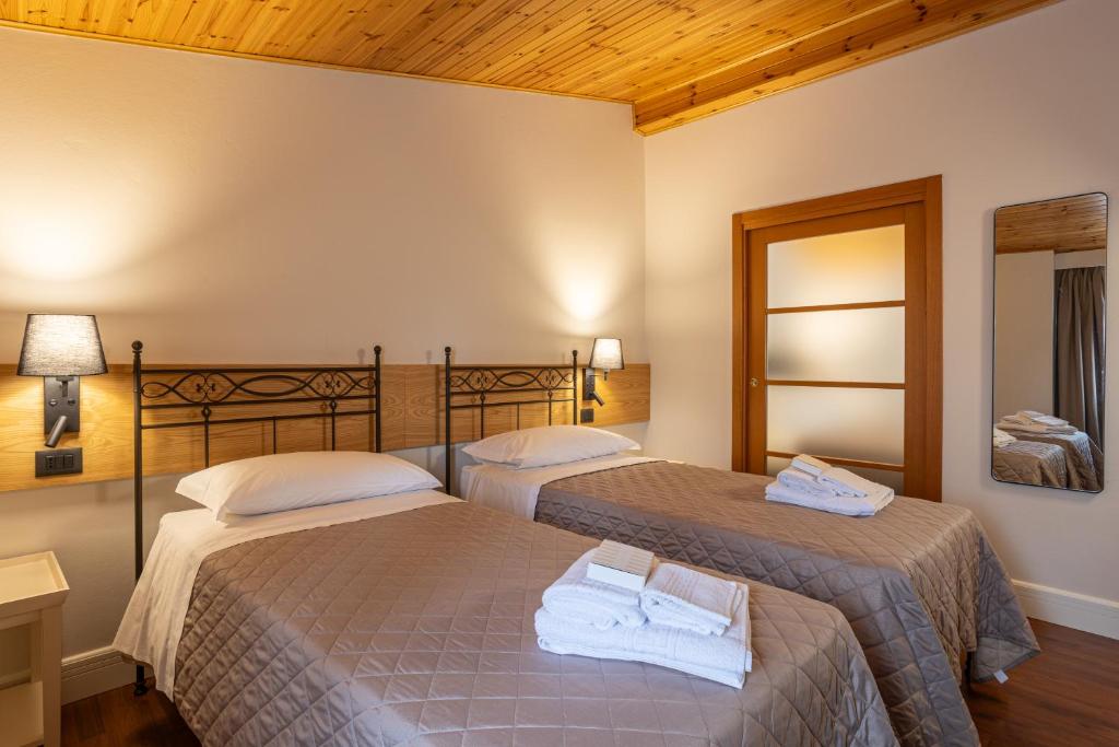 Postel nebo postele na pokoji v ubytování VillaChiara Gradara