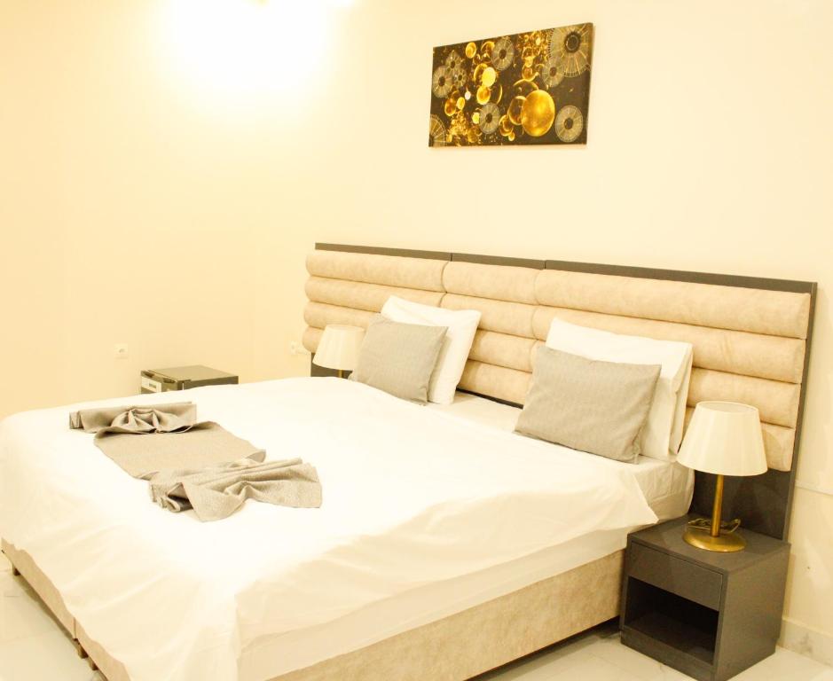 Postel nebo postele na pokoji v ubytování Urban Hotel Suites