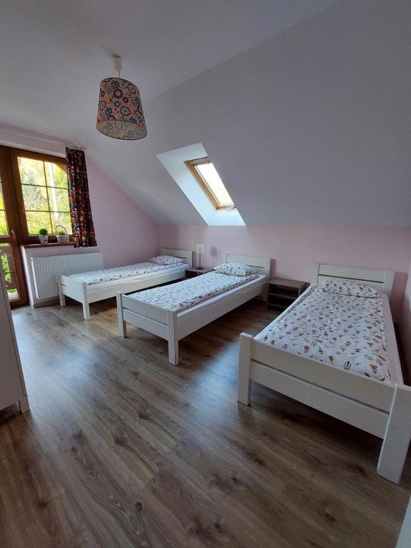Postel nebo postele na pokoji v ubytování Domek na Leśnej Wisła