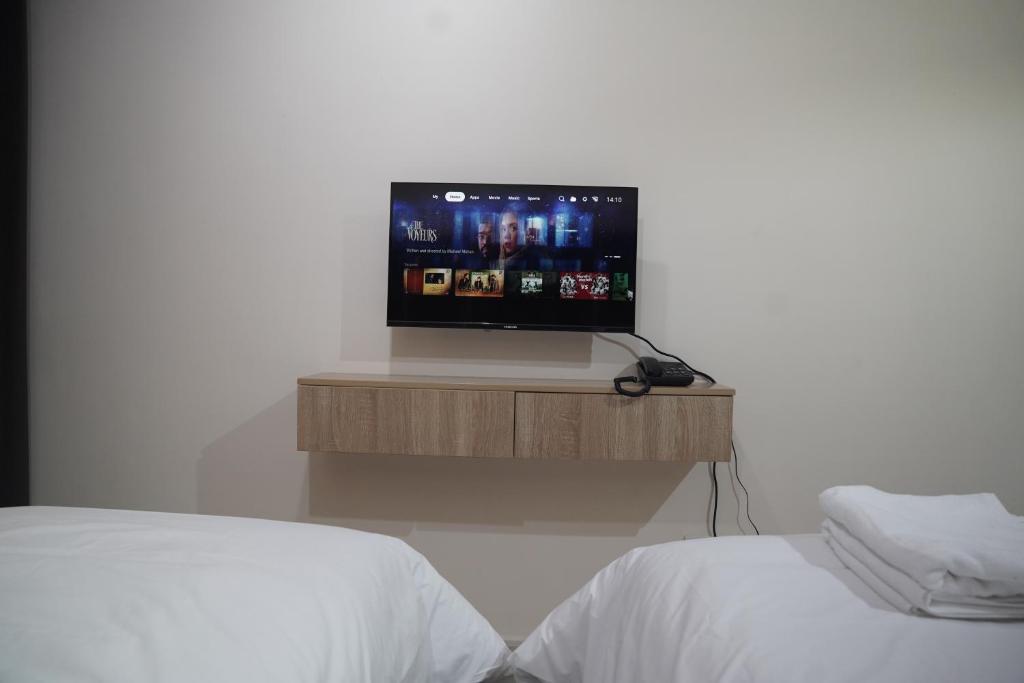 Postel nebo postele na pokoji v ubytování Landtech Vacation Homes - Baniyas Square