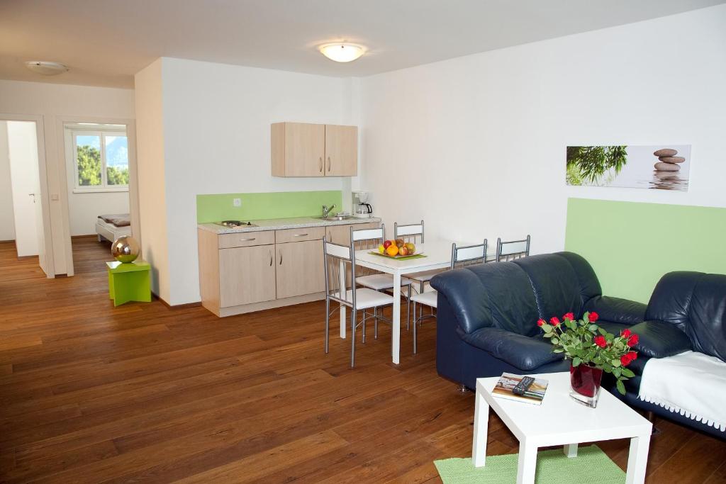 a living room with a couch and a table at Erlachmühle in Mondsee