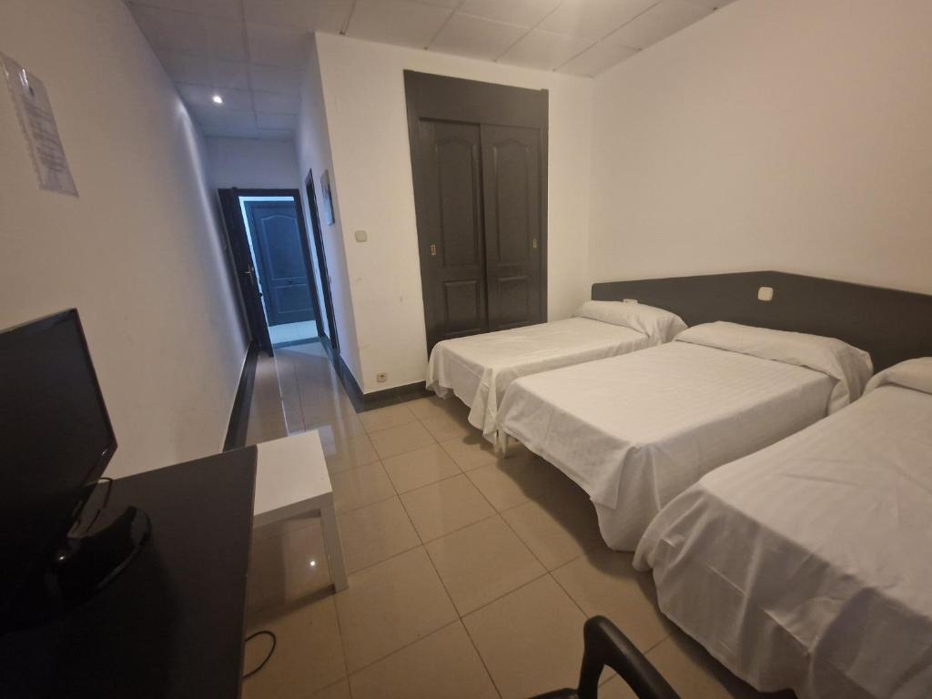 Postel nebo postele na pokoji v ubytování Hotel de castrillo LISBOA