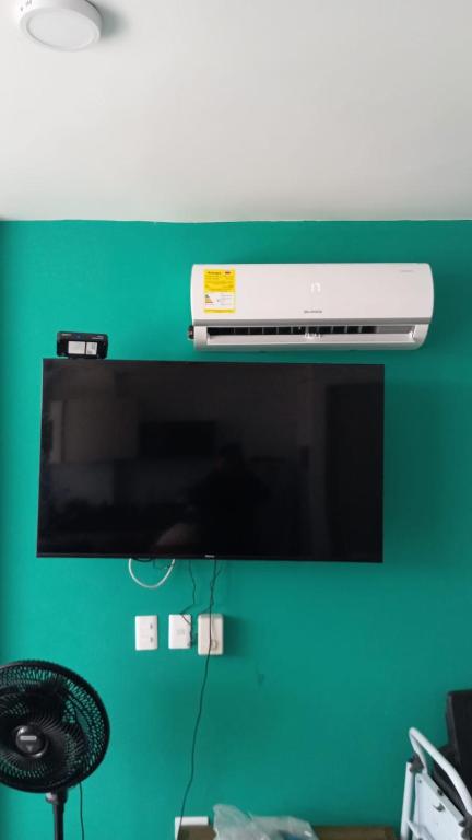 TV a/nebo společenská místnost v ubytování Casa de Playa frente al mar.