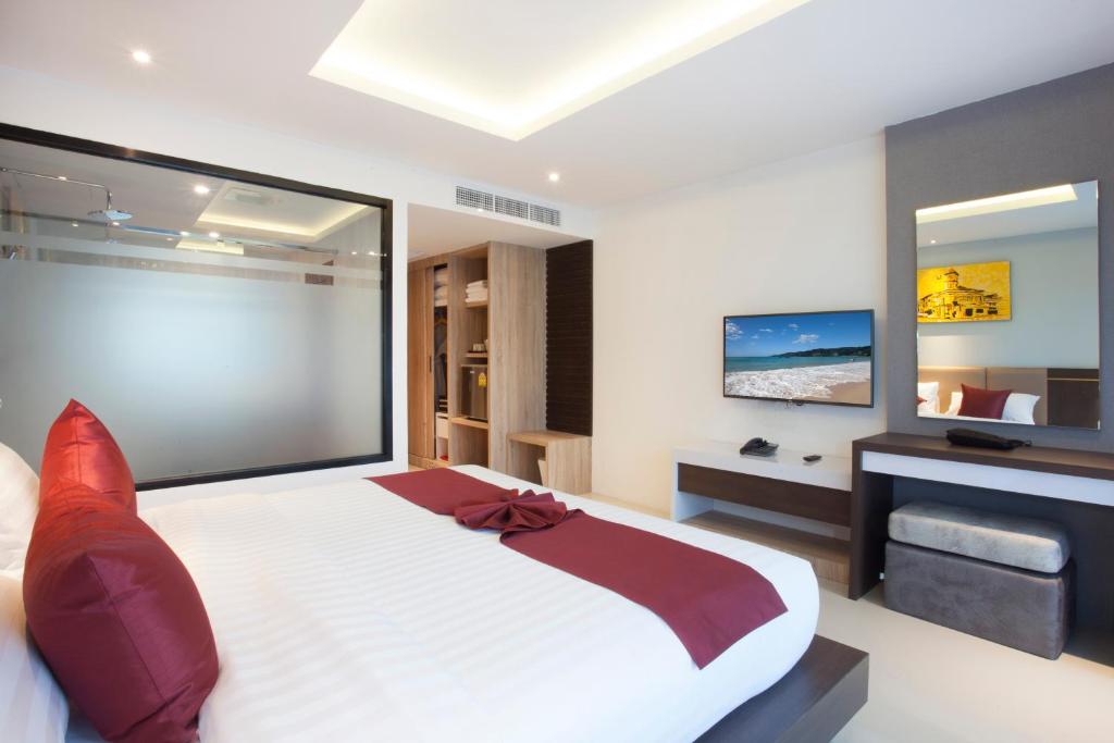 Postel nebo postele na pokoji v ubytování Paripas Patong Resort