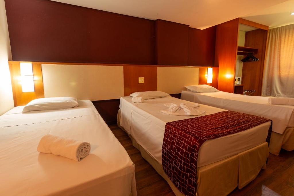 Cama ou camas em um quarto em Rede Andrade CWB