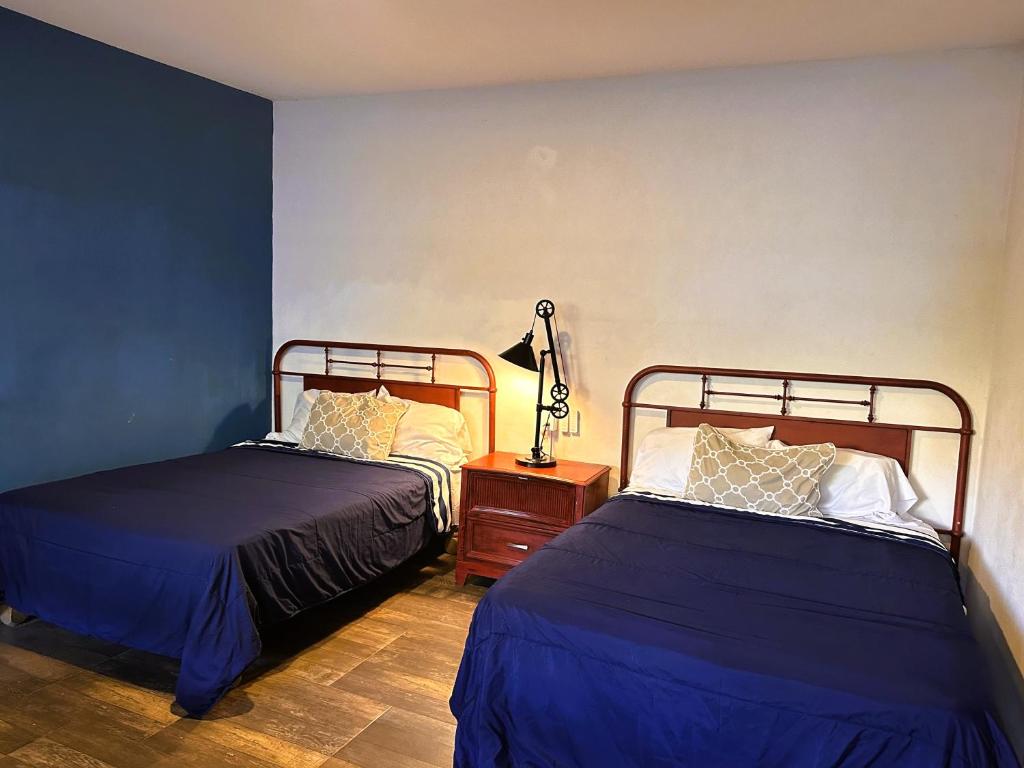 Una cama o camas en una habitación de Casona San Cayetano Suites & Lofts by SCE