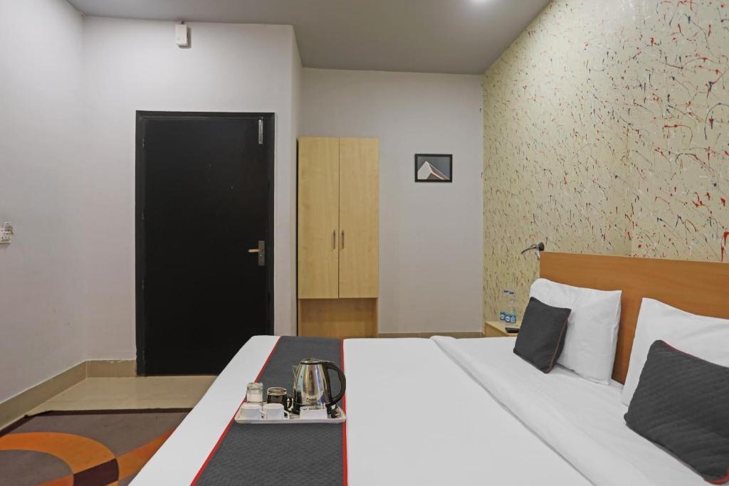 Postel nebo postele na pokoji v ubytování Super Townhouse Grand Pacific Ocean