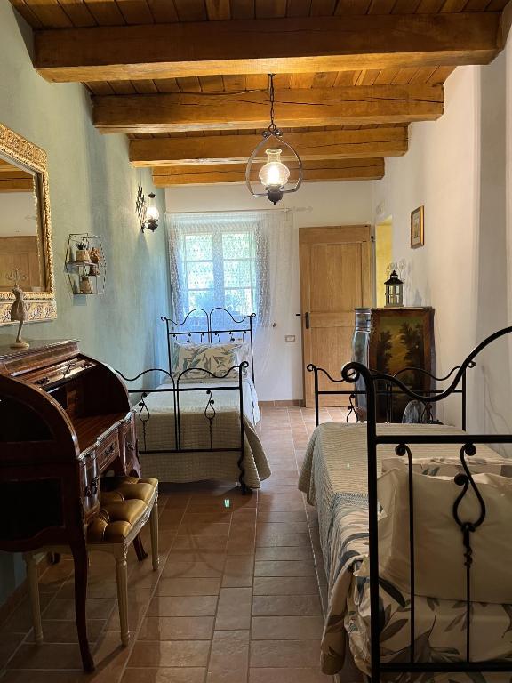 Łóżko lub łóżka w pokoju w obiekcie Agriturismo La Valle Dimenticata