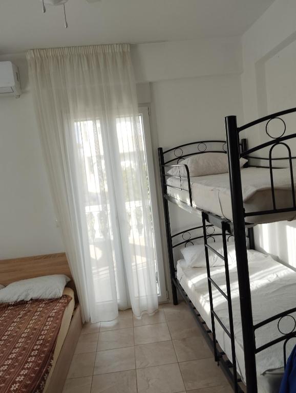 Postel nebo postele na pokoji v ubytování Apartment Mixail