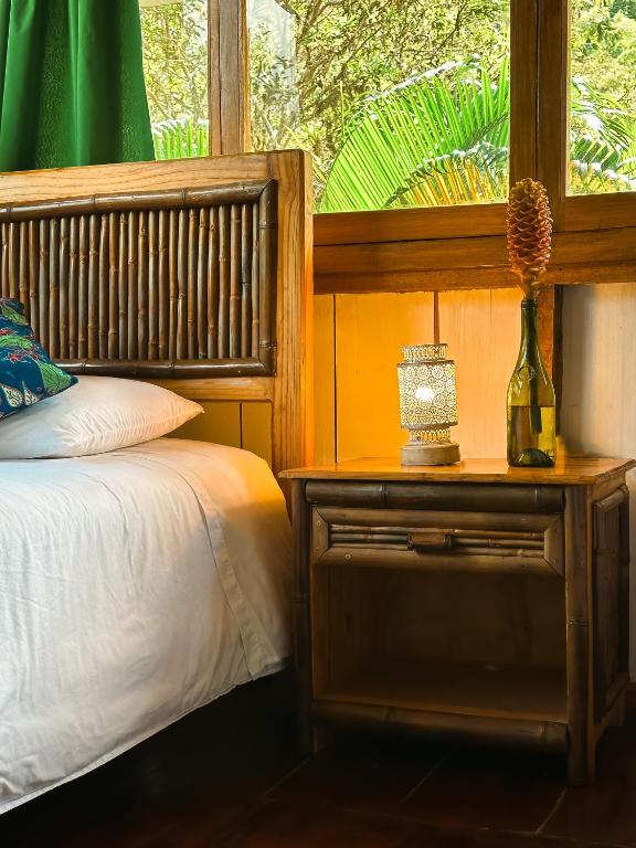 Postel nebo postele na pokoji v ubytování Hotel El Abrazo del Arbol
