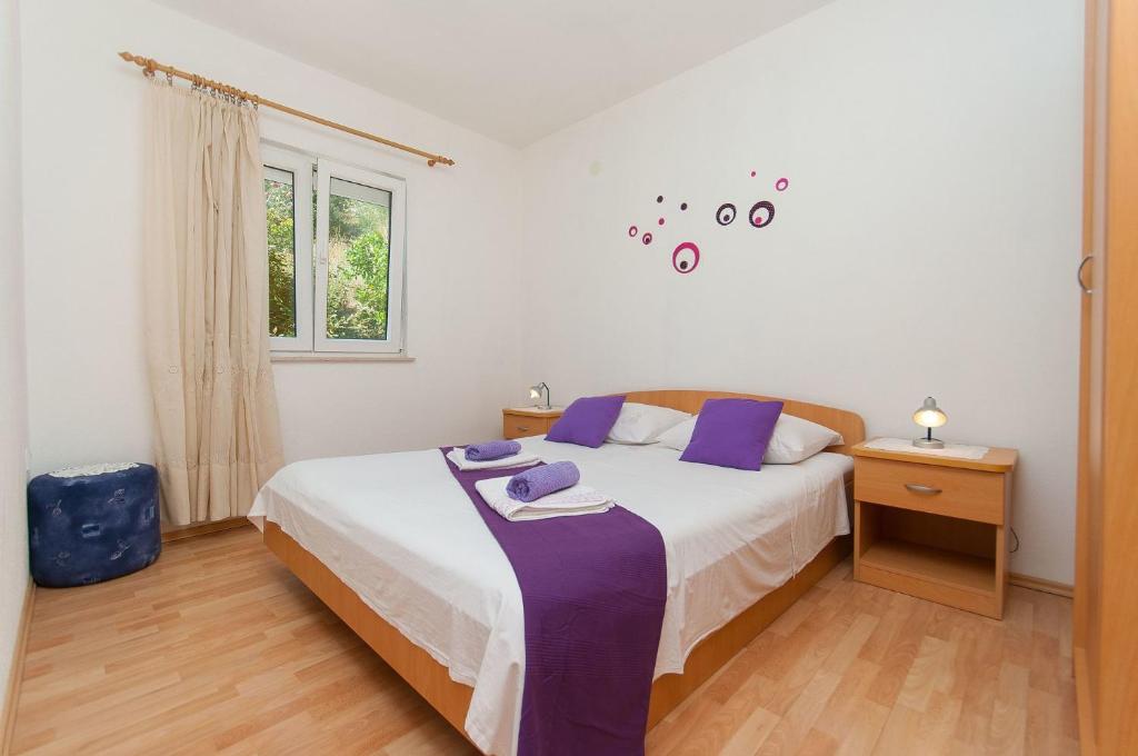 Posteľ alebo postele v izbe v ubytovaní Apartments Franka