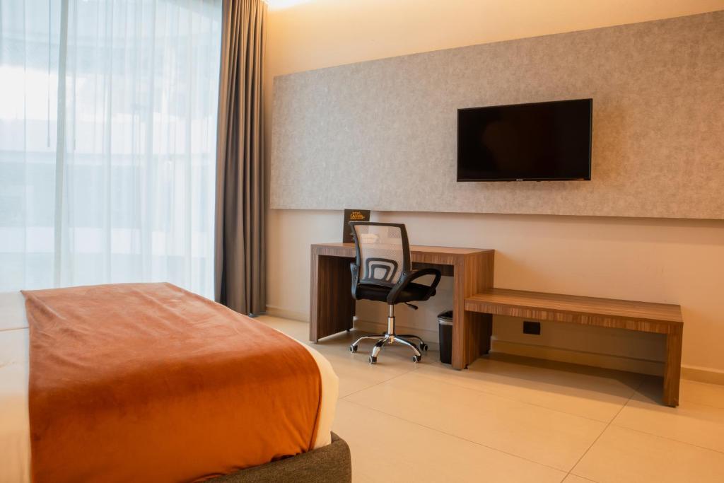 TV a/nebo společenská místnost v ubytování Grand Hotel&Casino Vía Dorada
