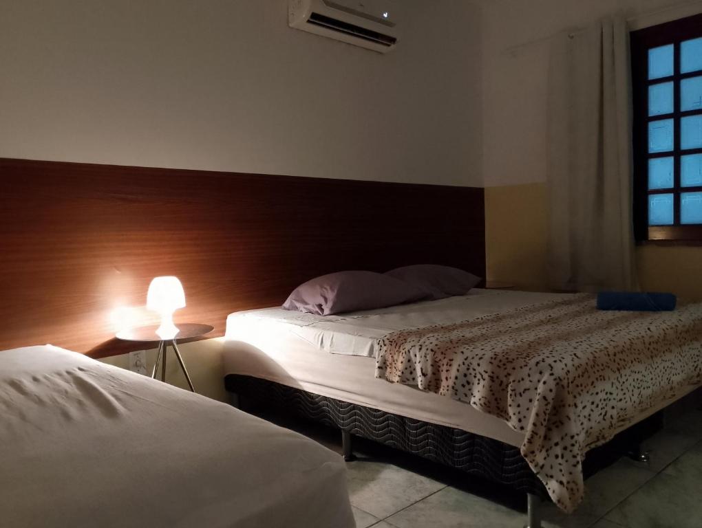 Postel nebo postele na pokoji v ubytování Hostel Aldeia Inn