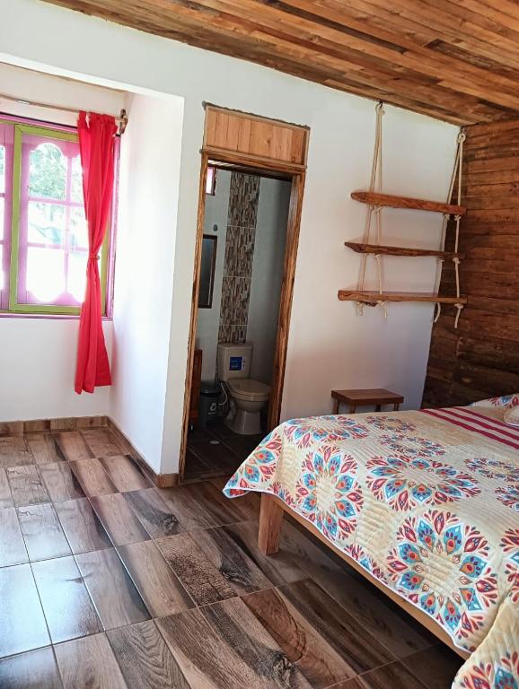 Ένα ή περισσότερα κρεβάτια σε δωμάτιο στο Hotel Areca