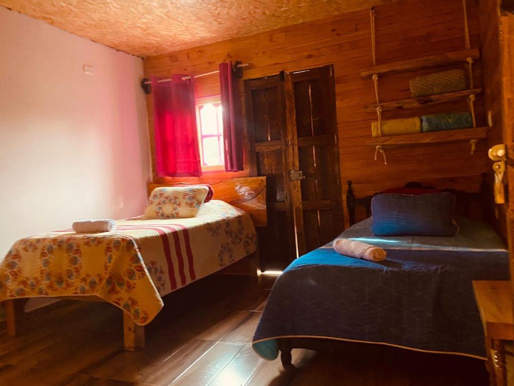 Ένα ή περισσότερα κρεβάτια σε δωμάτιο στο Hotel Areca