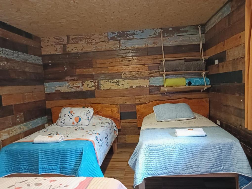 Ένα ή περισσότερα κρεβάτια σε δωμάτιο στο Hotel Areca