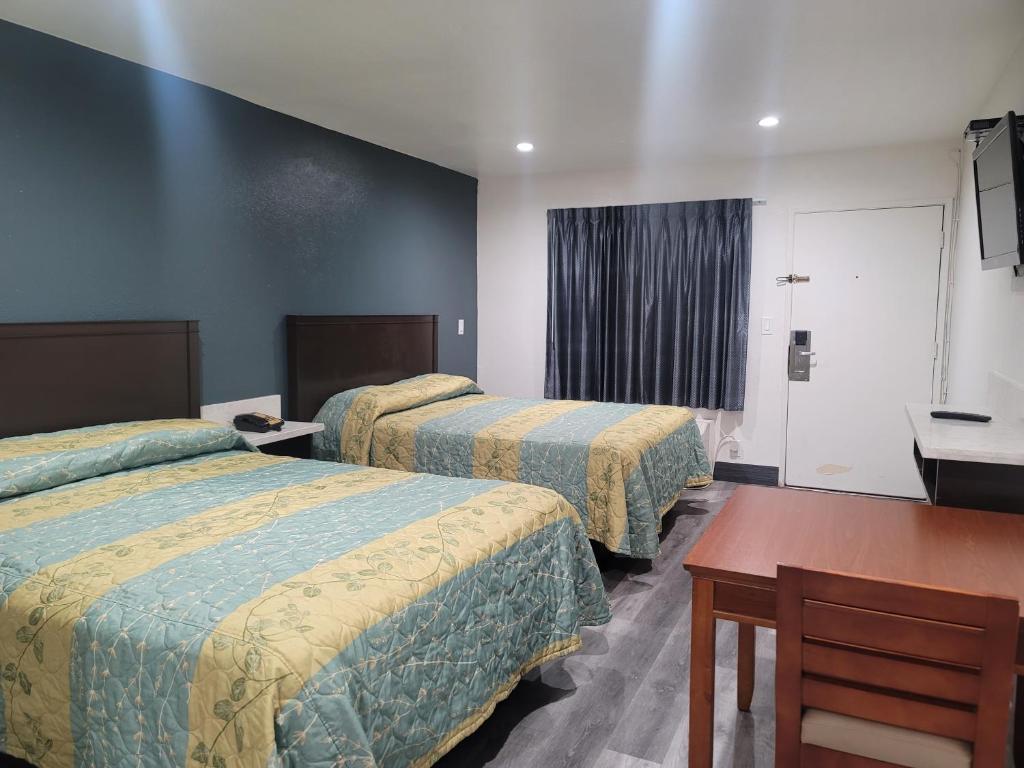 Una cama o camas en una habitación de Motel Moonlight