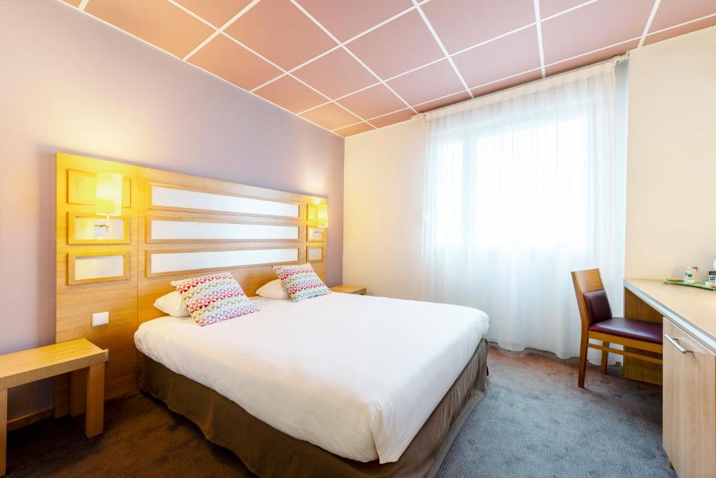Postel nebo postele na pokoji v ubytování Campanile Metz Nord - Talange