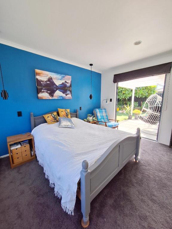 Ένα ή περισσότερα κρεβάτια σε δωμάτιο στο Peaceful beachside oasis