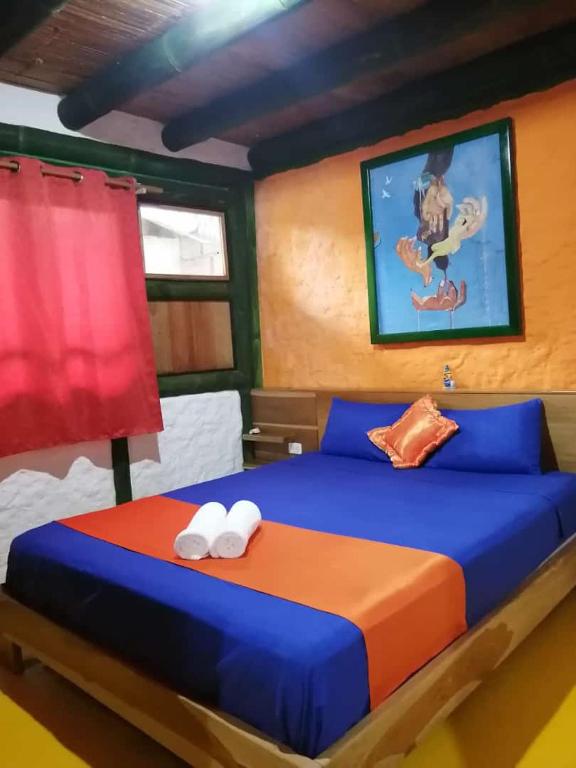 Postel nebo postele na pokoji v ubytování Hostal Yemayá Mompiche