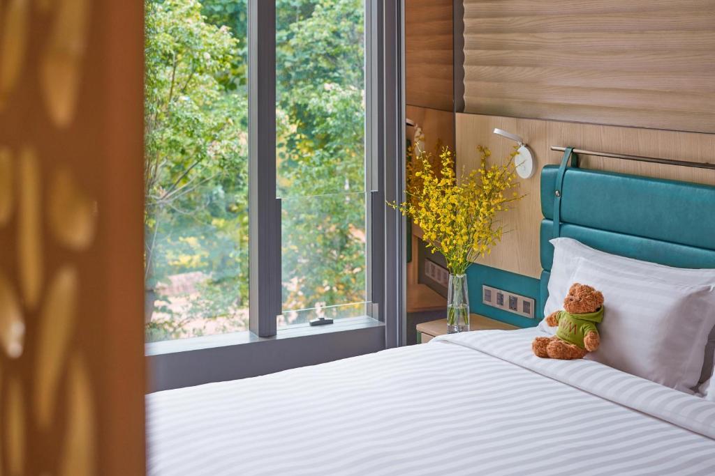 Ένα ή περισσότερα κρεβάτια σε δωμάτιο στο WM Hotel Hong Kong, Vignette Collection