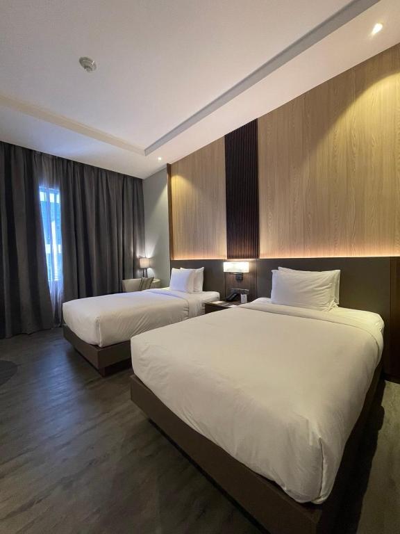 Postel nebo postele na pokoji v ubytování Courtyard by Marriott Melaka
