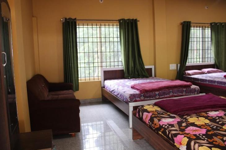 Postel nebo postele na pokoji v ubytování Prestige Nature Homestay Chikmagalur
