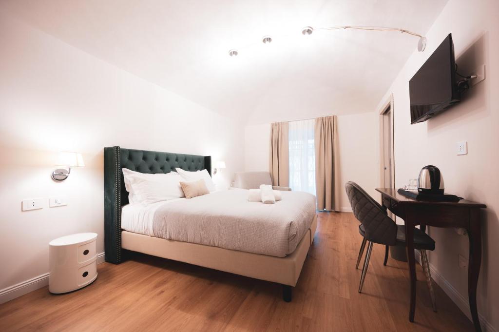 Postel nebo postele na pokoji v ubytování Carlo Felice Boutique Hotel