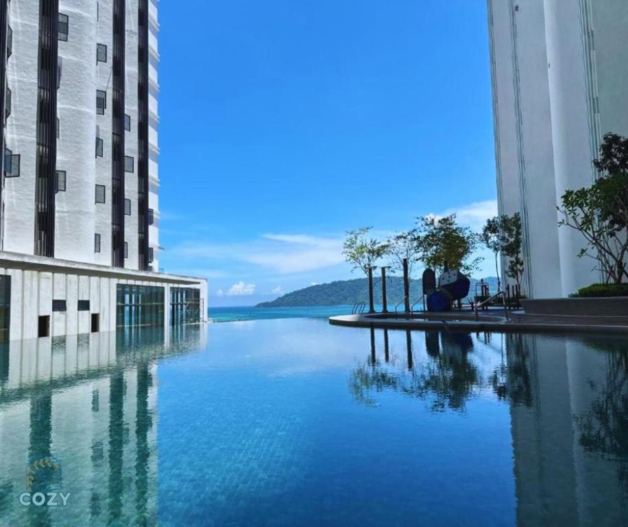a large body of water between two buildings at The Shore Seaview A1817 in Kota Kinabalu