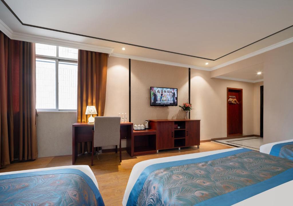 TV a/nebo společenská místnost v ubytování 东玉楼大酒店Zhangjiajie Dong Yu Lou Hotel